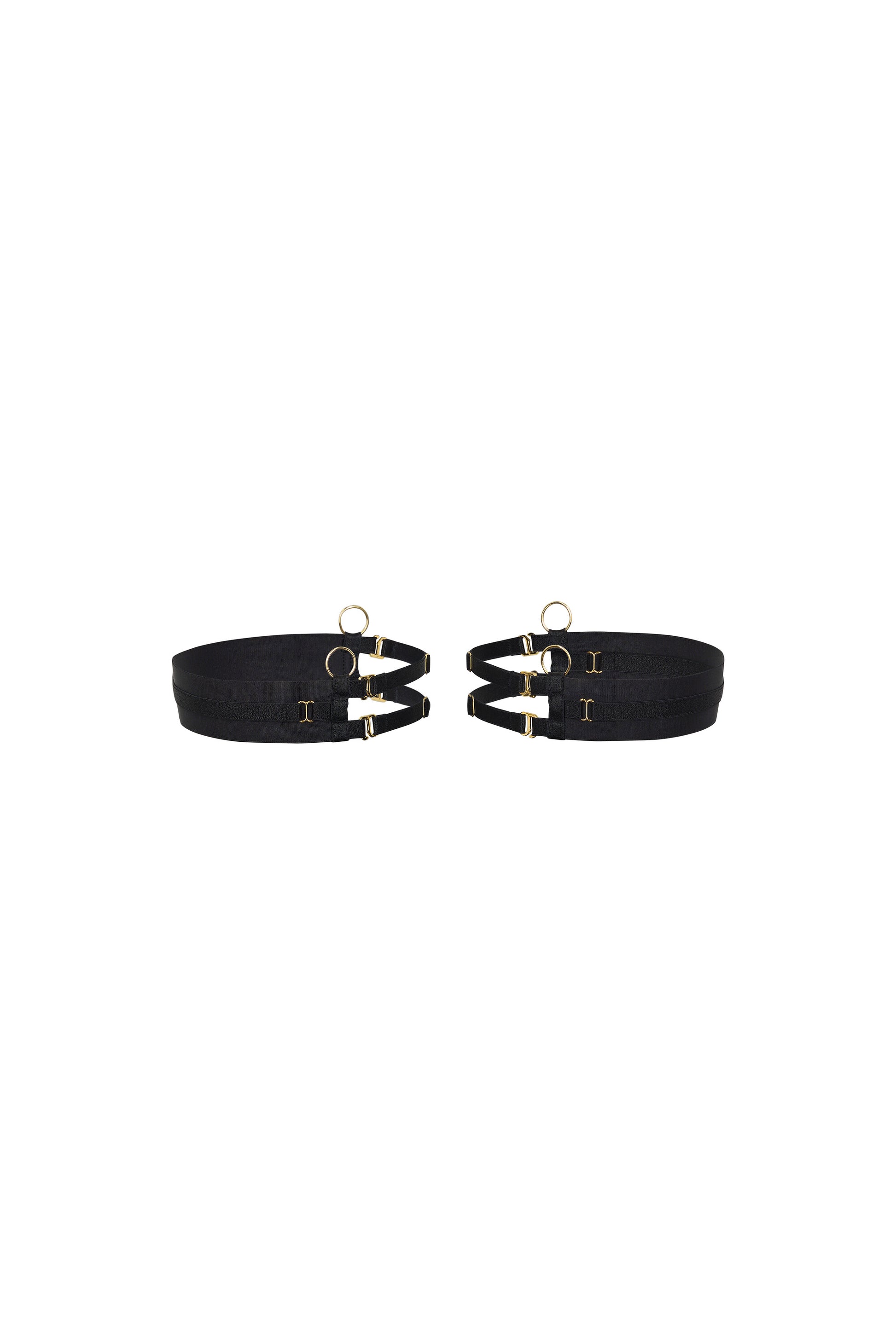 Back view of the Kate black thigh garters with wide bands, adjustable slim straps and gold-tone hardware on a white background.