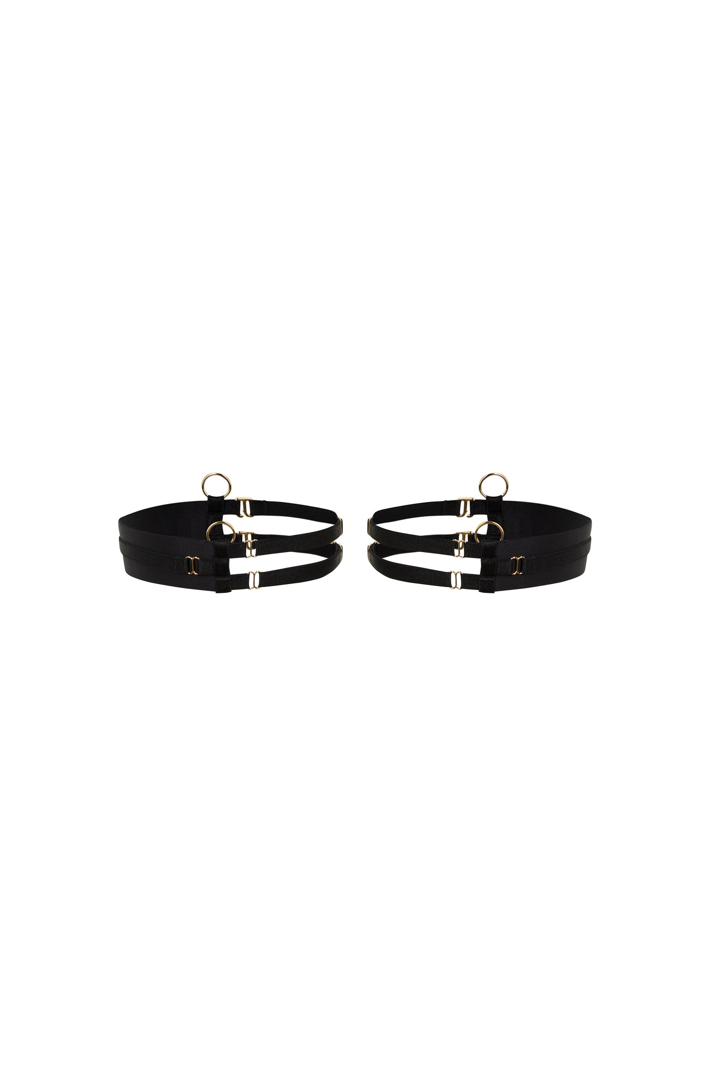 Kate black thigh garters with wide bands, slim adjustable straps and gold-tone hardware on a white background.