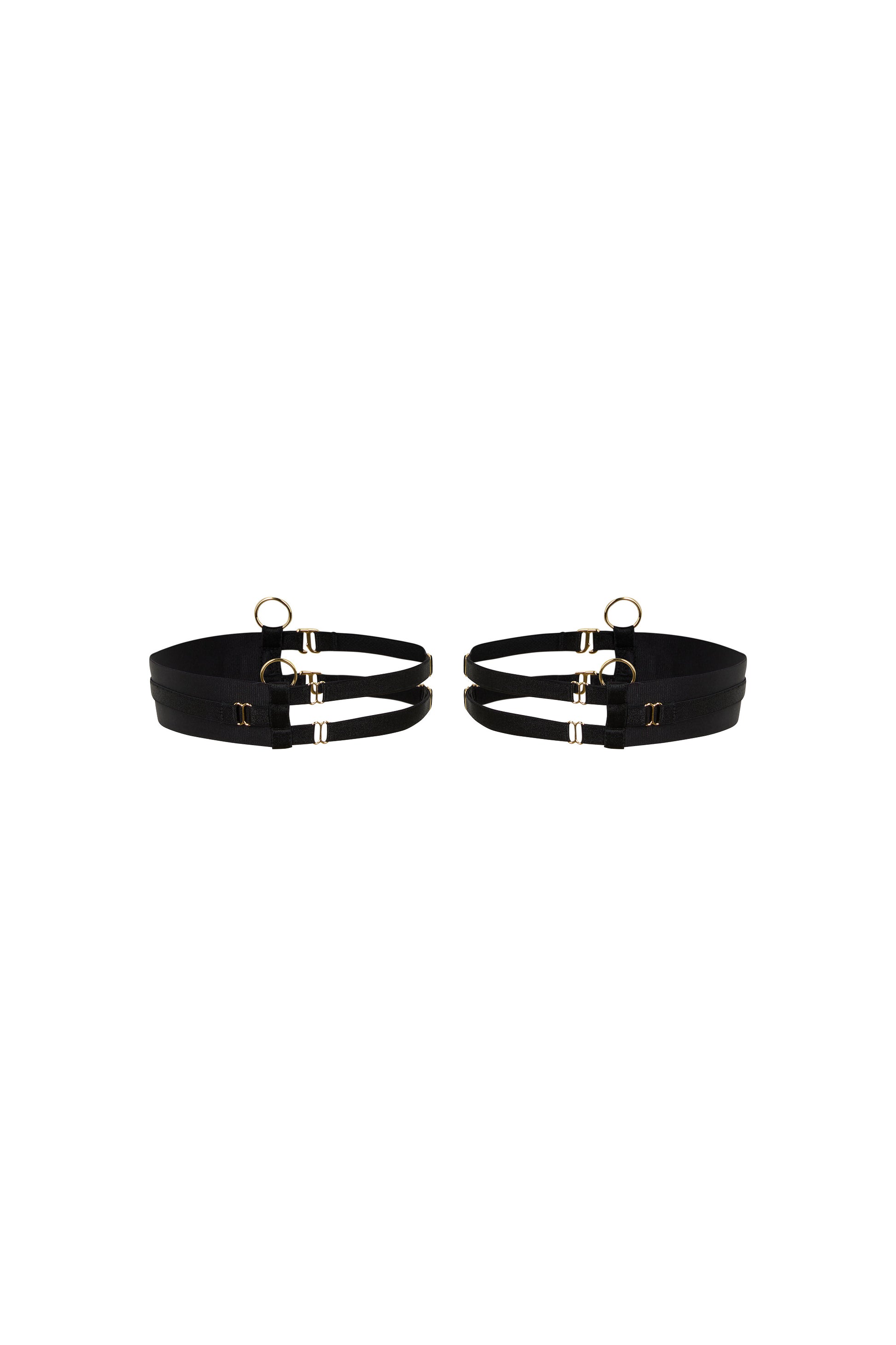 Kate black thigh garters with wide bands, slim adjustable straps and gold-tone hardware on a white background.