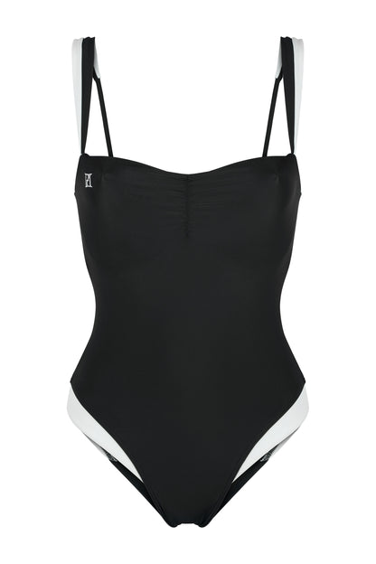 Monaco black and ivory one-piece swimsuit with hidden underwire support, logo embroidery, ivory framing and European swim fabric on a white background.