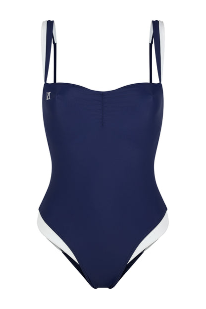 Monaco navy and ivory one-piece swimsuit with hidden underwire support, logo embroidery, ivory contouring and European swim fabric on a white background.