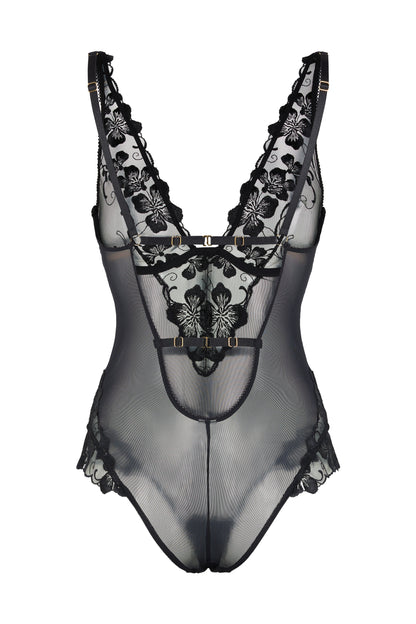 Back view of the Valerie black bodysuit with open back, sheer contouring mesh, adjustable straps and gold-tone hardware on a white background.
