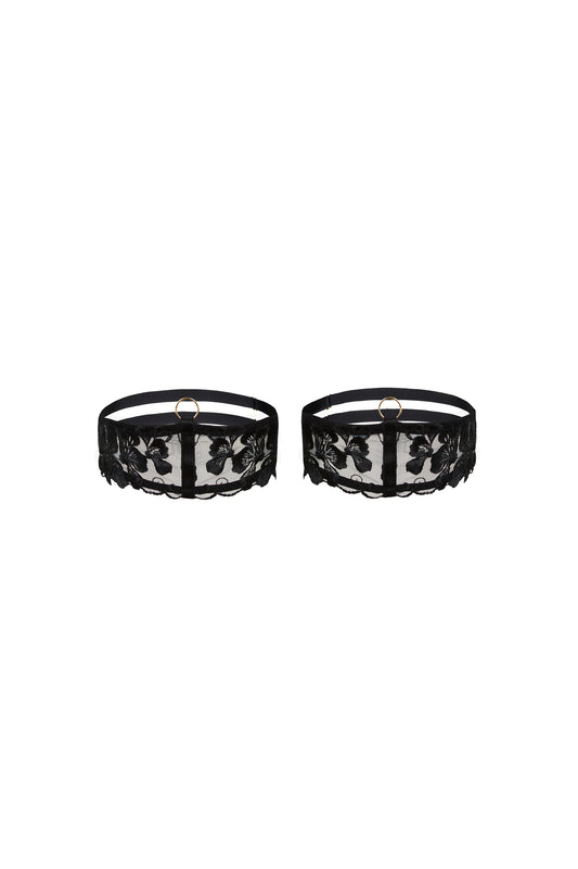 Valerie black thigh garters with Swiss embroidery over sheer tulle, adjustable straps and gold-tone hardware on a white background.