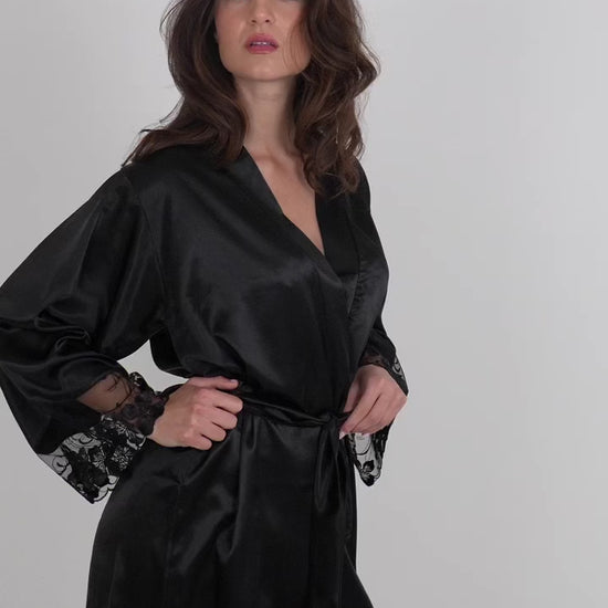 Valerie black floral embroidered robe in satin and tulle, worn by model, 360 degree view against light grey backdrop.